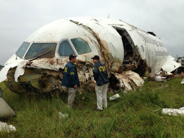 NTSB investigators examining the scene of the UPS Flight 1354 crash in 2013